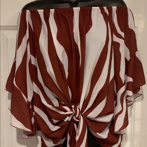 Off the shoulder top with geometric design.